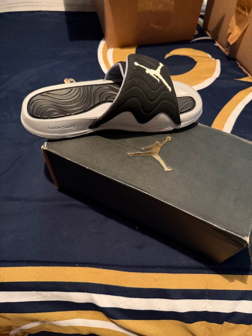 Jordan 4s Black and White Slide Sandals with Jumpman Logo